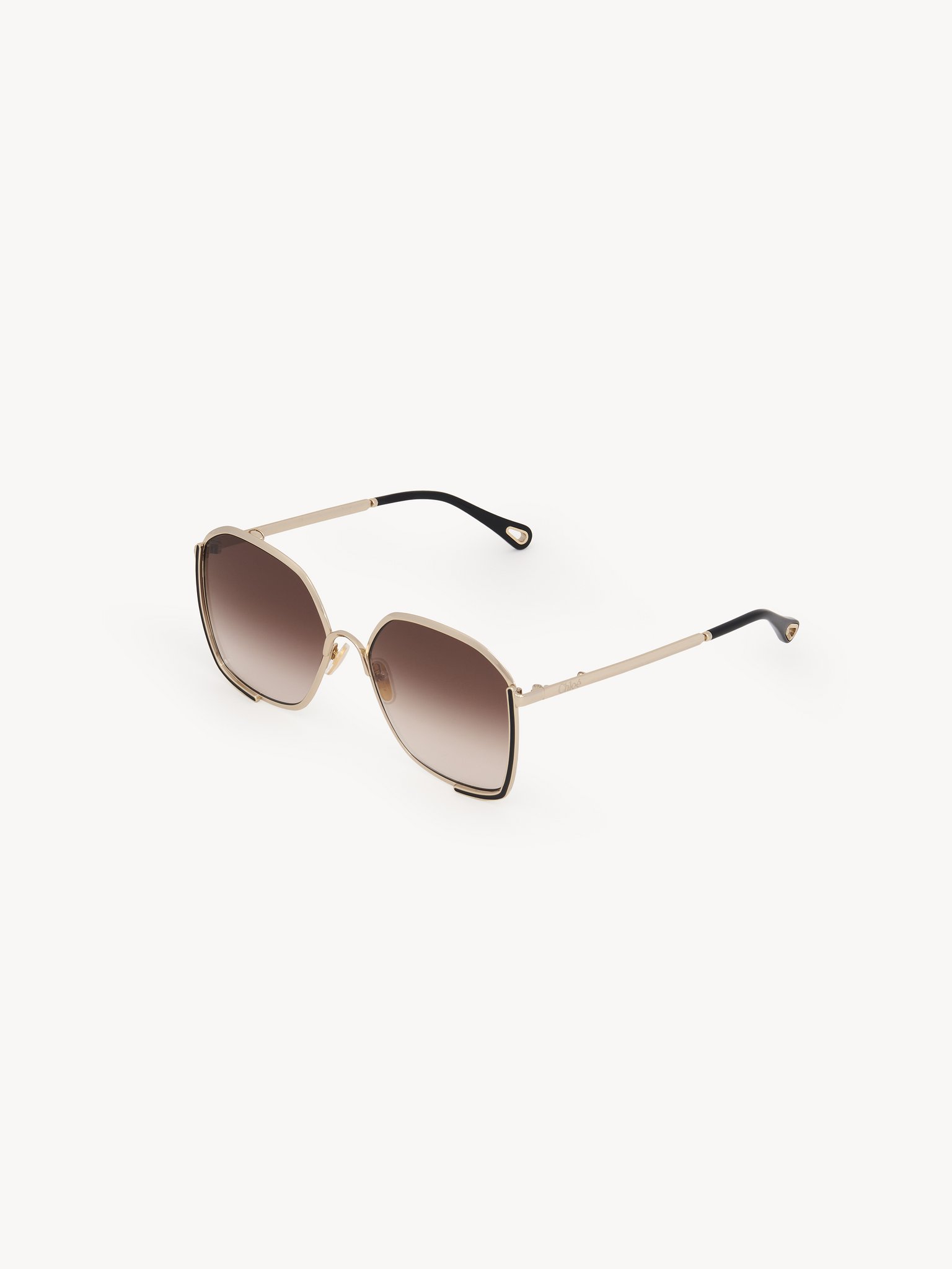 Chloé Charms sunglasses Gold metal, black enamel & bio-based nylon
Gradient brown lenses Top view of the product