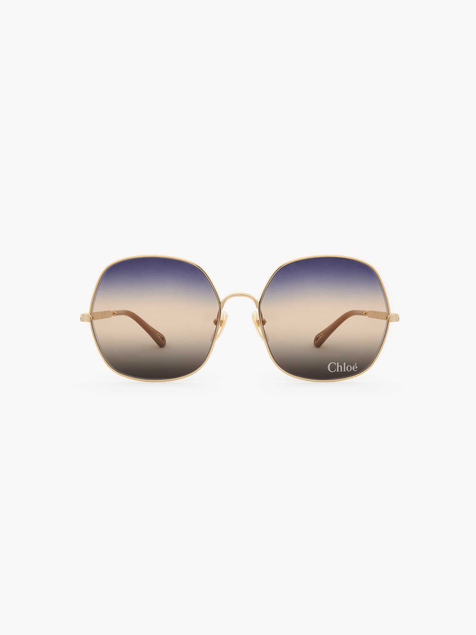 Aly sunglasses Gold metal & bio-based nylon
Gradient blue, beige & brown lenses Back view of the product