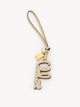 Logo bag charm in shiny leather Shiny calfskin & brass
Deep Ivory