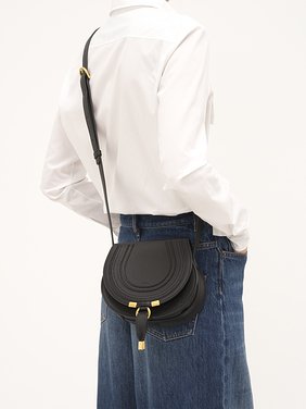 Small Marcie saddle bag in grained leather Grained calfskin
Black Front view of the product being worn