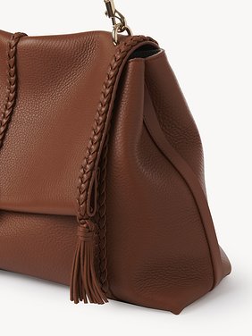 Large Penelope soft shoulder bag in grained leather Grained bull leather with leather braids
Caramel 