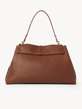 Large Penelope soft shoulder bag in grained leather Grained bull leather with leather braids
Caramel Product detail