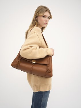 Large Penelope soft shoulder bag in grained leather Grained bull leather with leather braids
Caramel [*** acc_altImage_shotH ***]