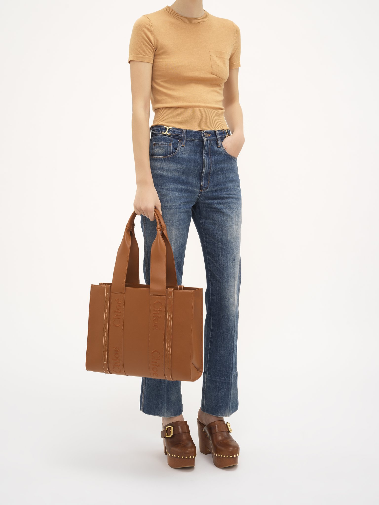 Woody tote bag in soft leather Smooth calfskin with Chloé logo
Caramel Front view of the product being worn