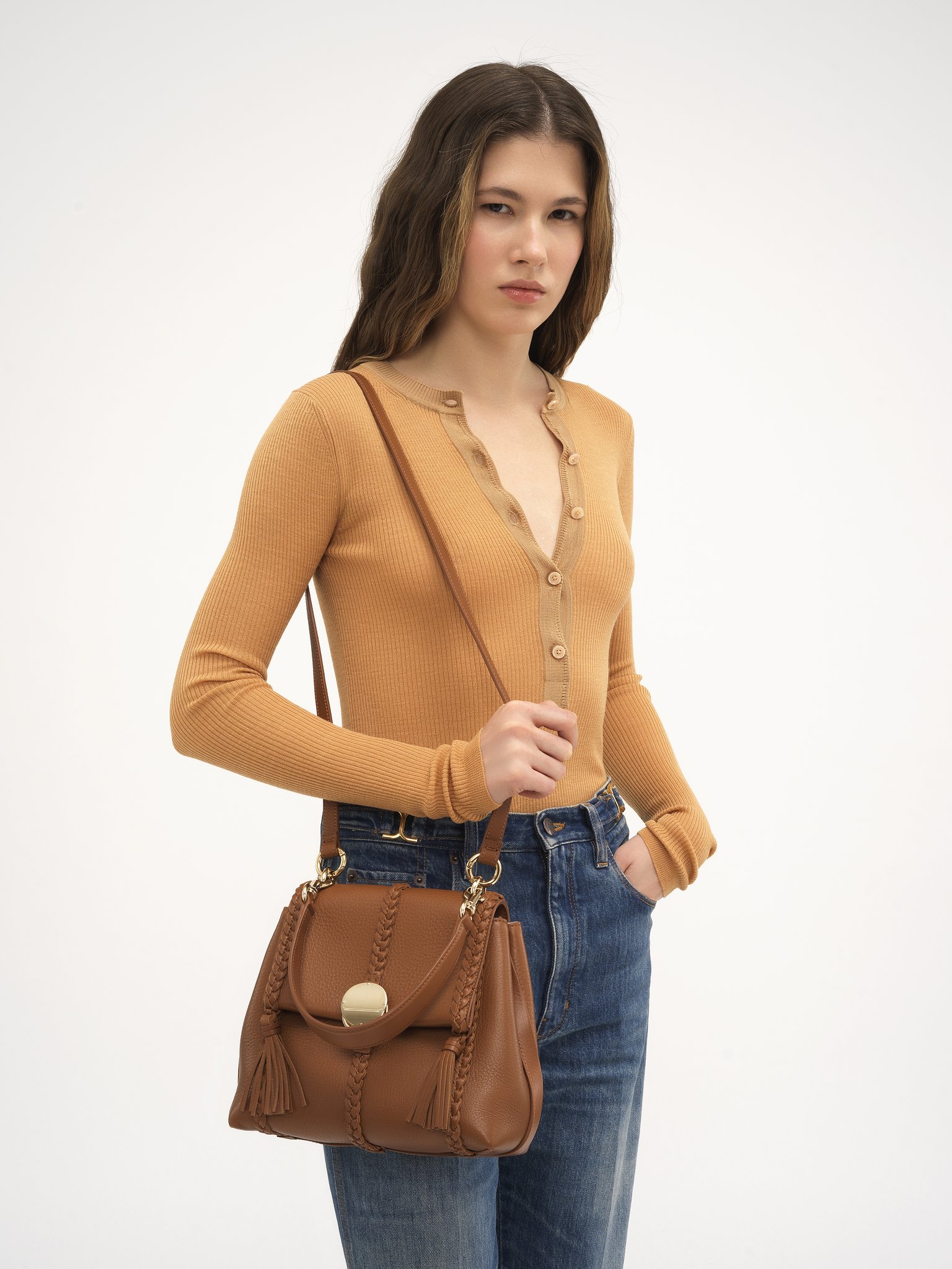 Small Penelope soft shoulder bag in grained leather Grained bull leather with leather braids
Caramel Front view of the product being worn