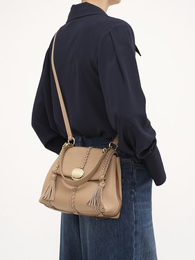 Small Penelope soft shoulder bag in grained leather Grained bull leather with leather braids
Nomad Beige 