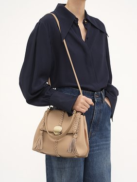 Small Penelope soft shoulder bag in grained leather Grained bull leather with leather braids
Nomad Beige [*** acc_altImage_shotH ***]