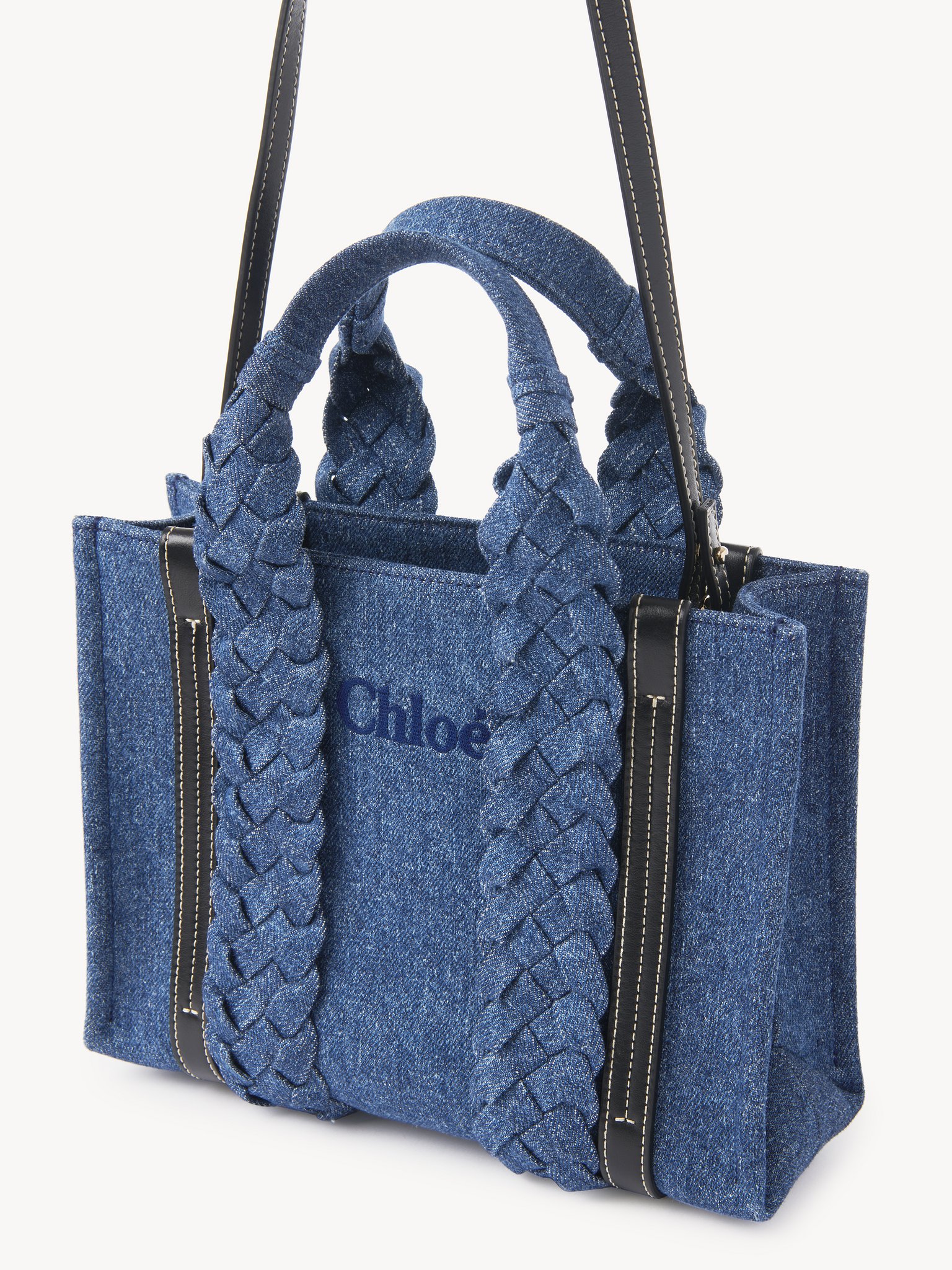 Small Woody tote bag in denim Recycled cotton denim & shiny calfskin with braided handles
Denim Product detail