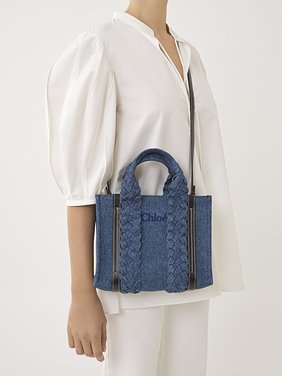 Small Woody tote bag in denim Recycled cotton denim & shiny calfskin with braided handles
Denim Back view of the product