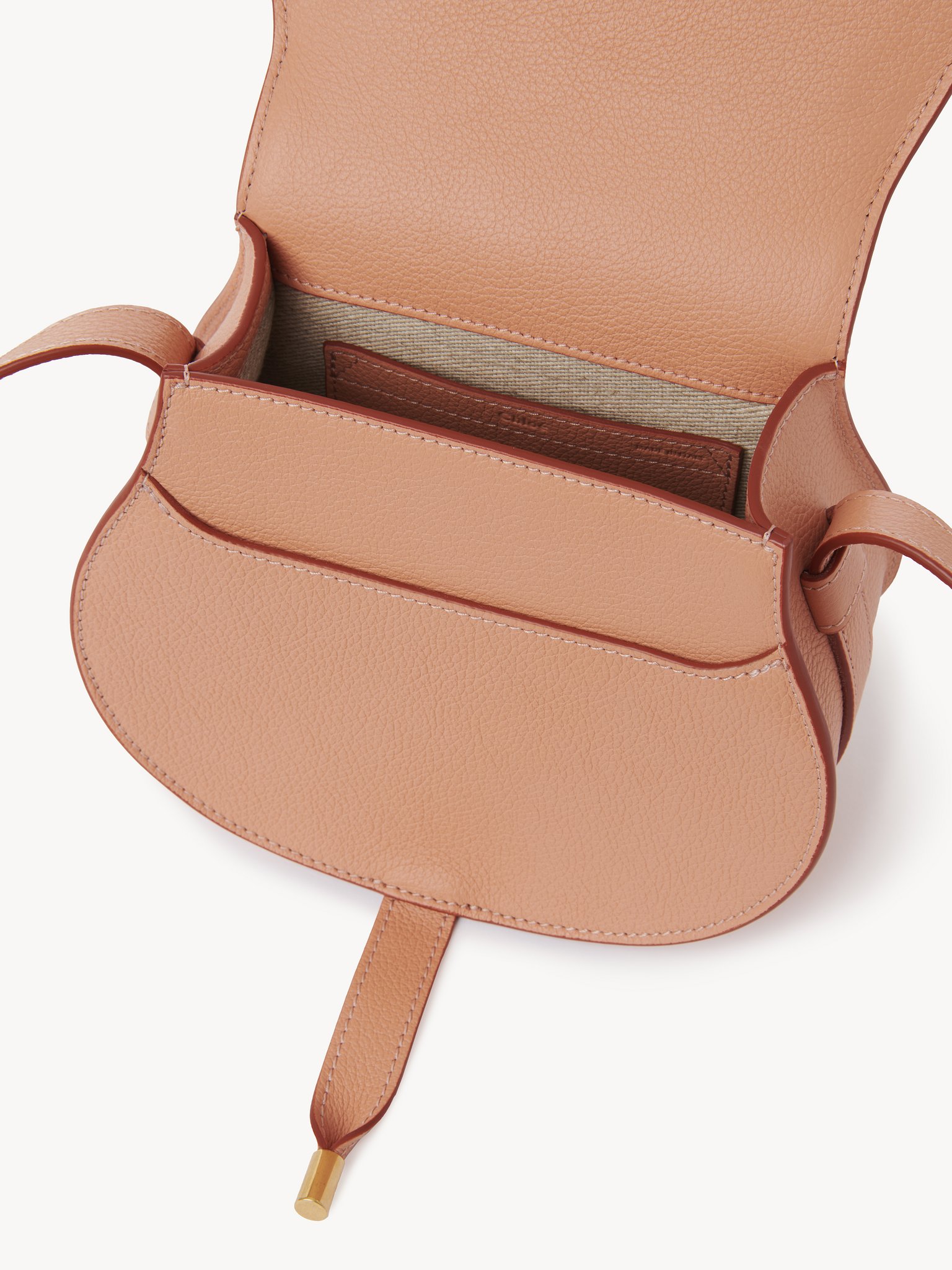 Small Marcie saddle bag in grained leather Grained calfskin
Terracotta Pink Front view of the product being worn