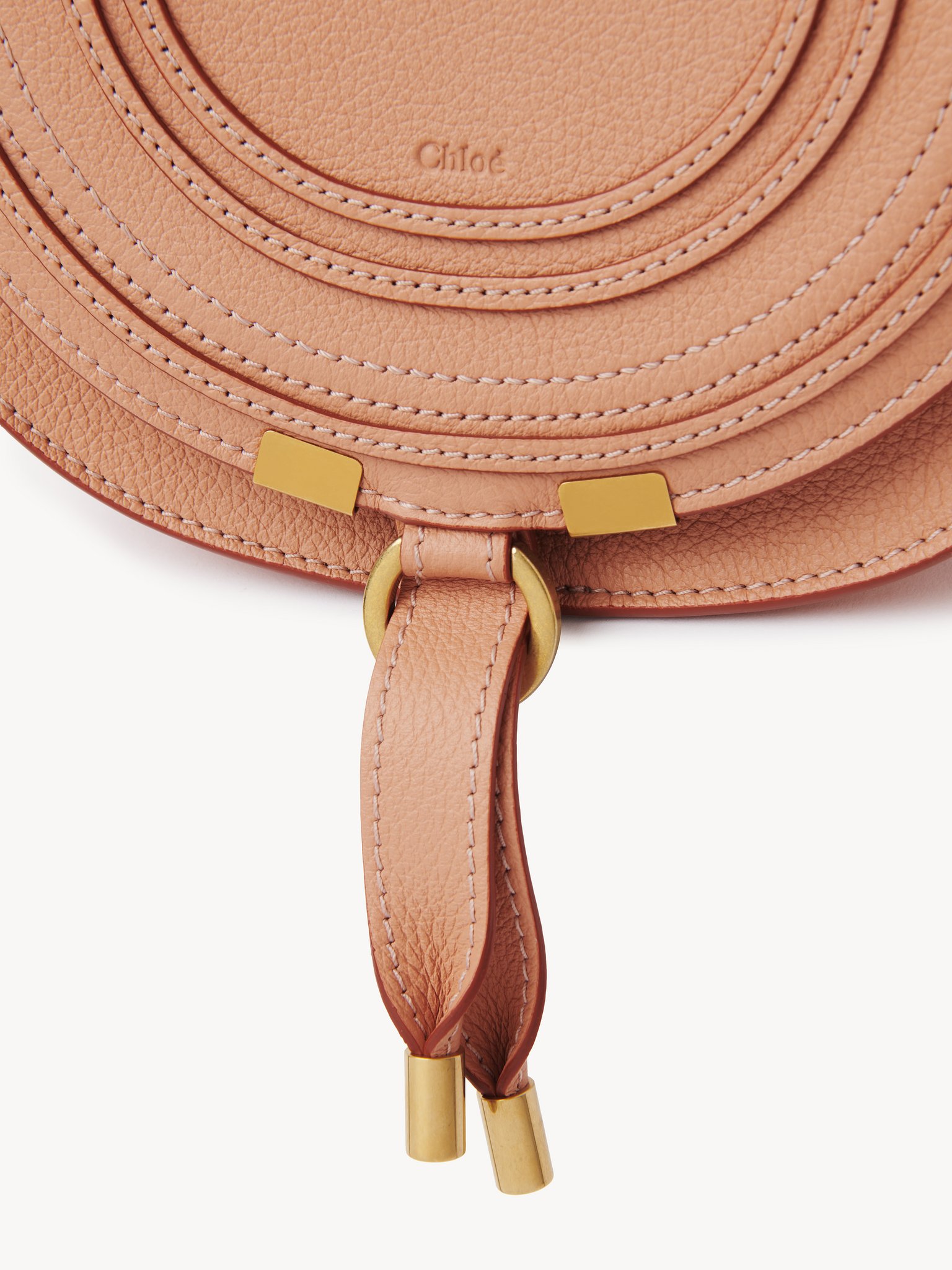 Small Marcie saddle bag in grained leather Grained calfskin
Terracotta Pink Front view of the product being worn