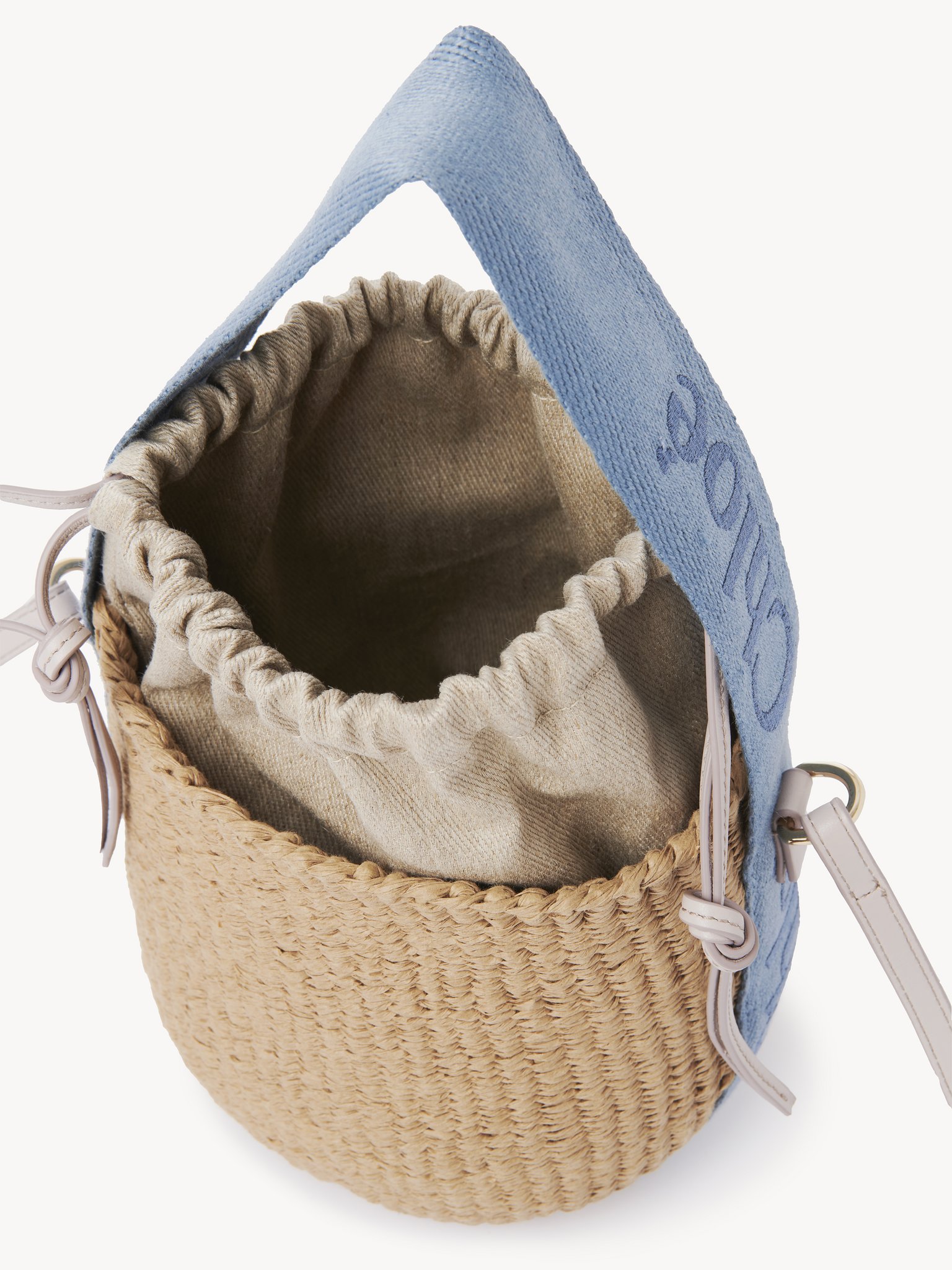 Small Woody tote bag in natural fibres Fair-trade paper, calfskin & webbing with Chloé logo
Washed Blue Front view of the product being worn