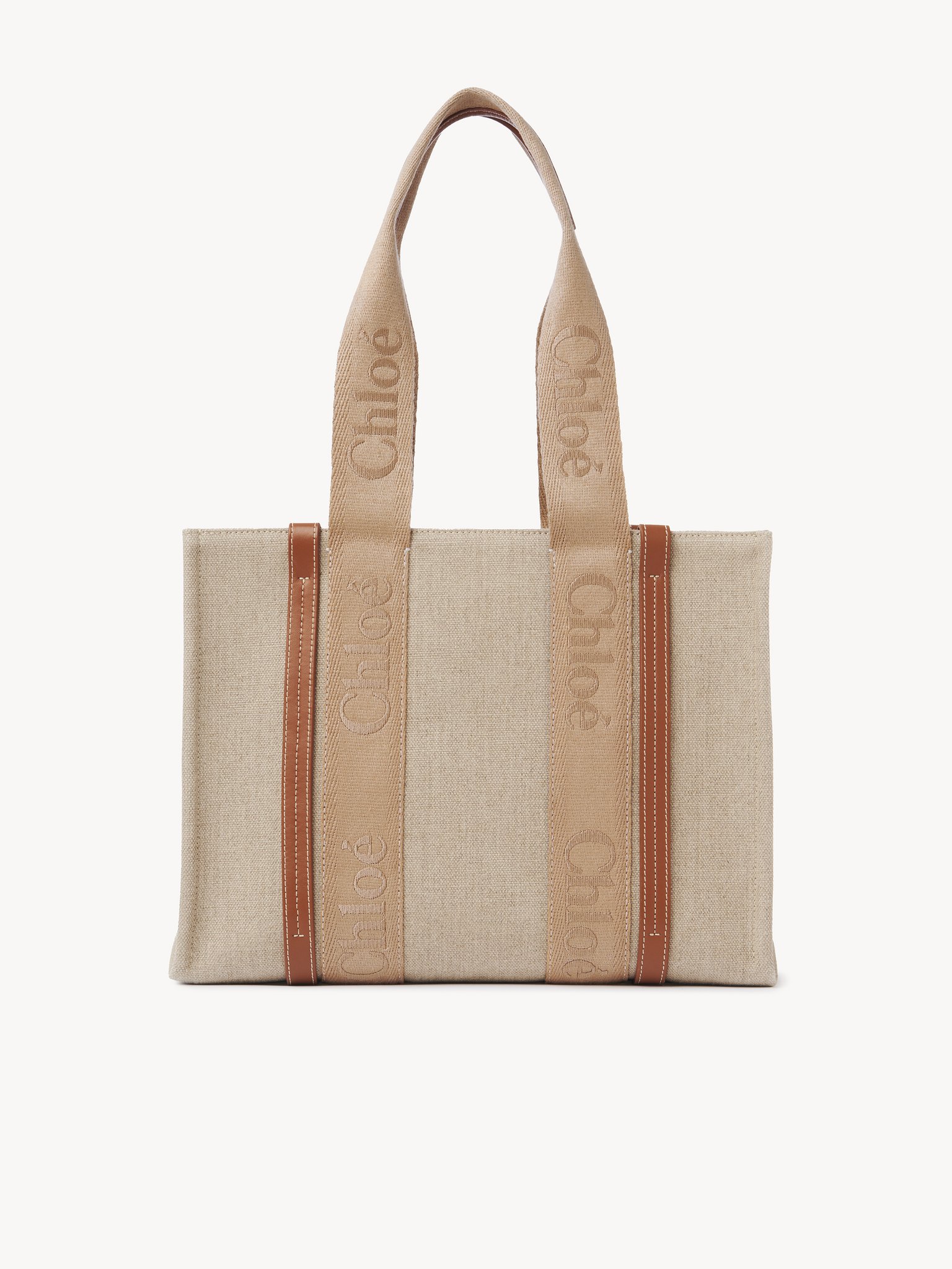 Woody tote bag in linen Linen canvas, calfskin & webbing with Chloé logo
Soft Tan Top view of the product