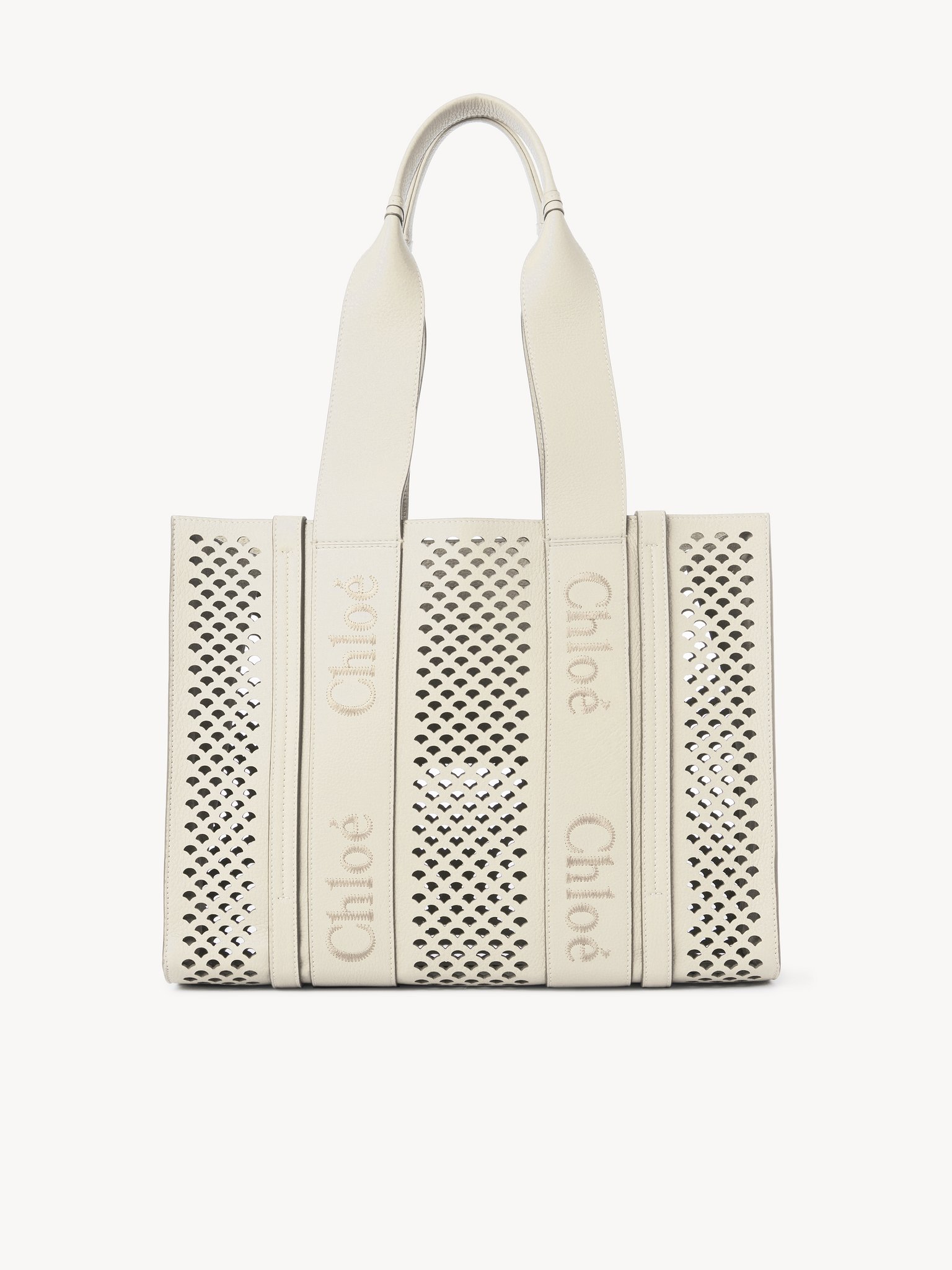 Tote bag Woody in pelle granata Pelle di vitello granata con bordi ondulati traforati e logo Chloé
Misty Ivory