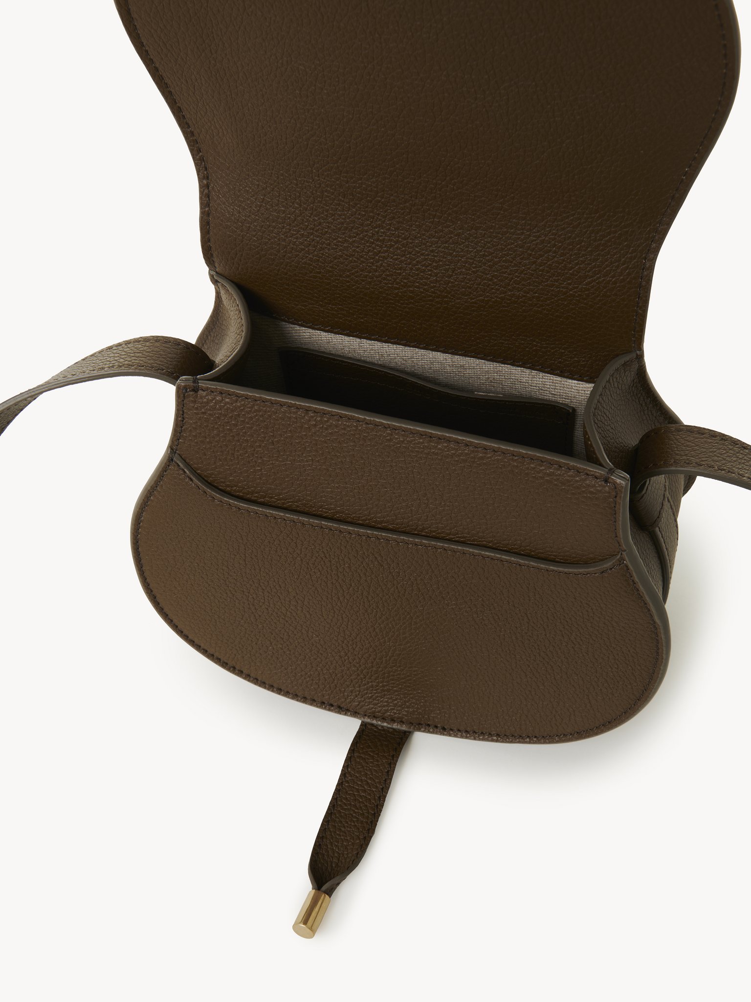 Small Marcie saddle bag in grained leather Grained calfskin
Dark Khaki Front view of the product being worn