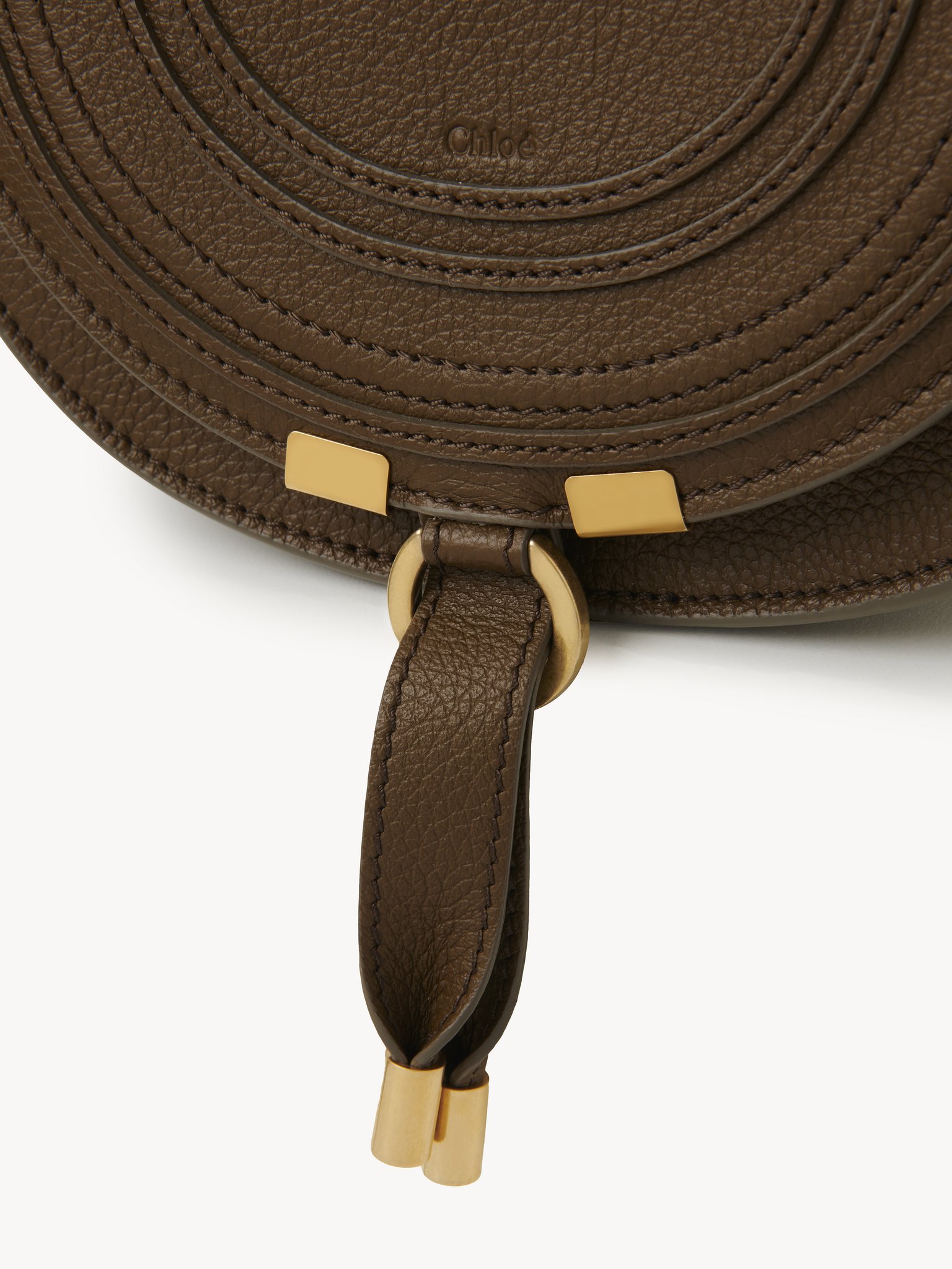 Small Marcie saddle bag in grained leather Grained calfskin
Dark Khaki Front view of the product being worn