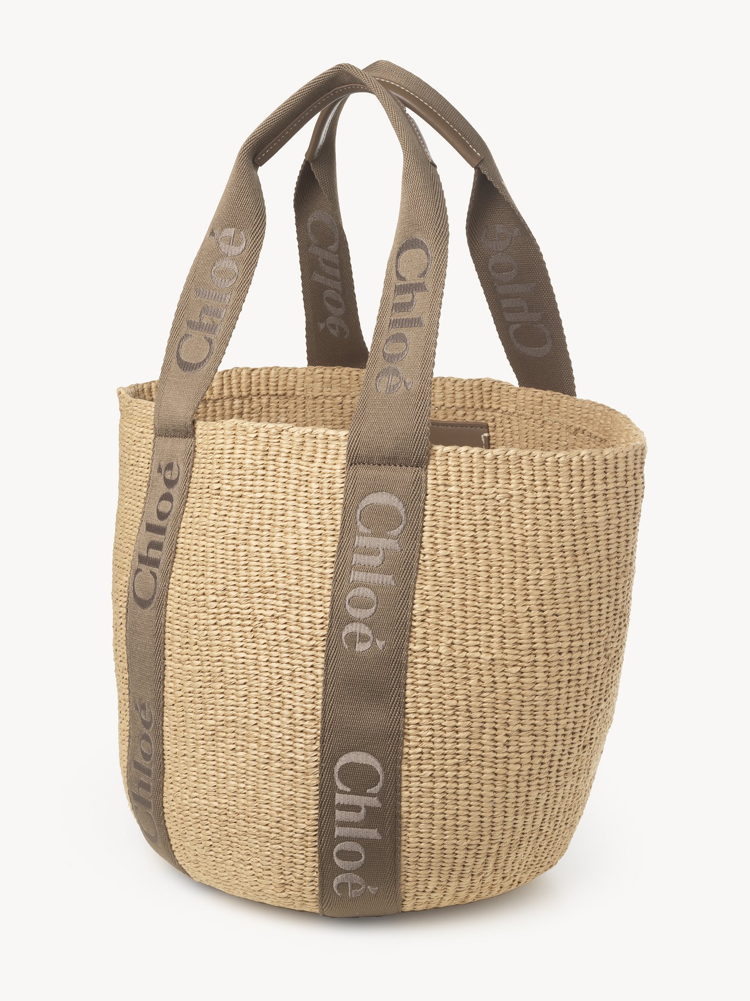 Large Woody basket in fair-trade natural fibers Fair-trade paper, calfskin & webbing with Chloé logo embroidery
Dark Nut Product detail