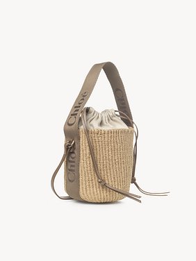 Small Woody basket in fair-trade natural fibers Fair-trade paper, calfskin & webbing with Chloé logo
Dark Nut