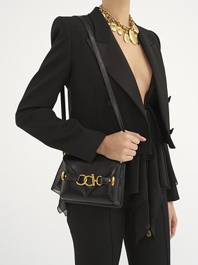 Mini crossbody Cape bag in grained leather Grained calfskin
Black Front view of the product being worn