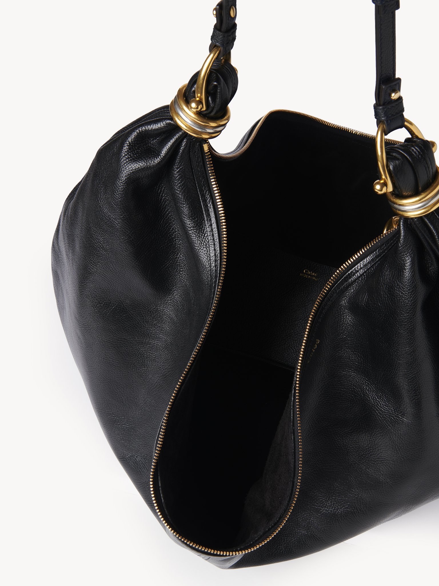 Large Bracelet Hobo bag in grained leather Shiny grained calfskin
Black Front view of the product being worn