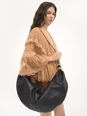 Large Bracelet Hobo bag in grained leather Shiny grained calfskin
Black Back view of the product