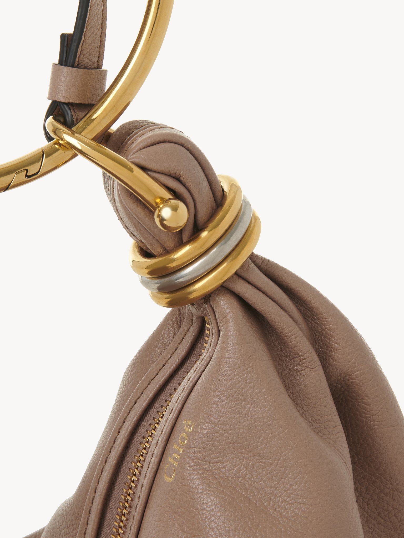 Small Bracelet Hobo bag in grained leather Shiny grained calfskin
Woodrose Front view of the product being worn