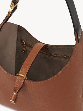 Small Marcie hobo bag in grained leather Grained calfskin
Tan Front view of the product being worn