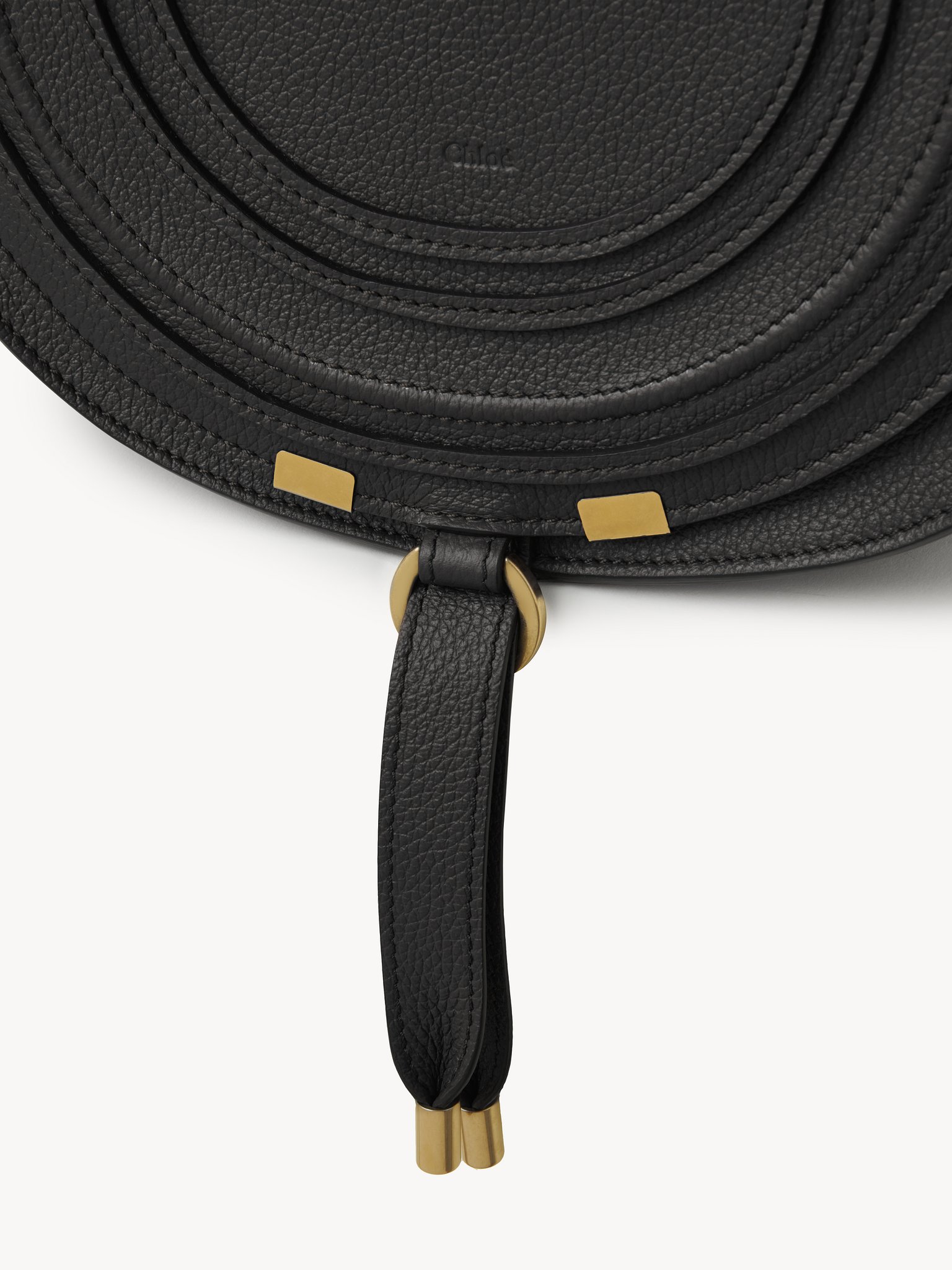 Marcie saddle bag in grained leather Grained calfskin
Black Front view of the product being worn