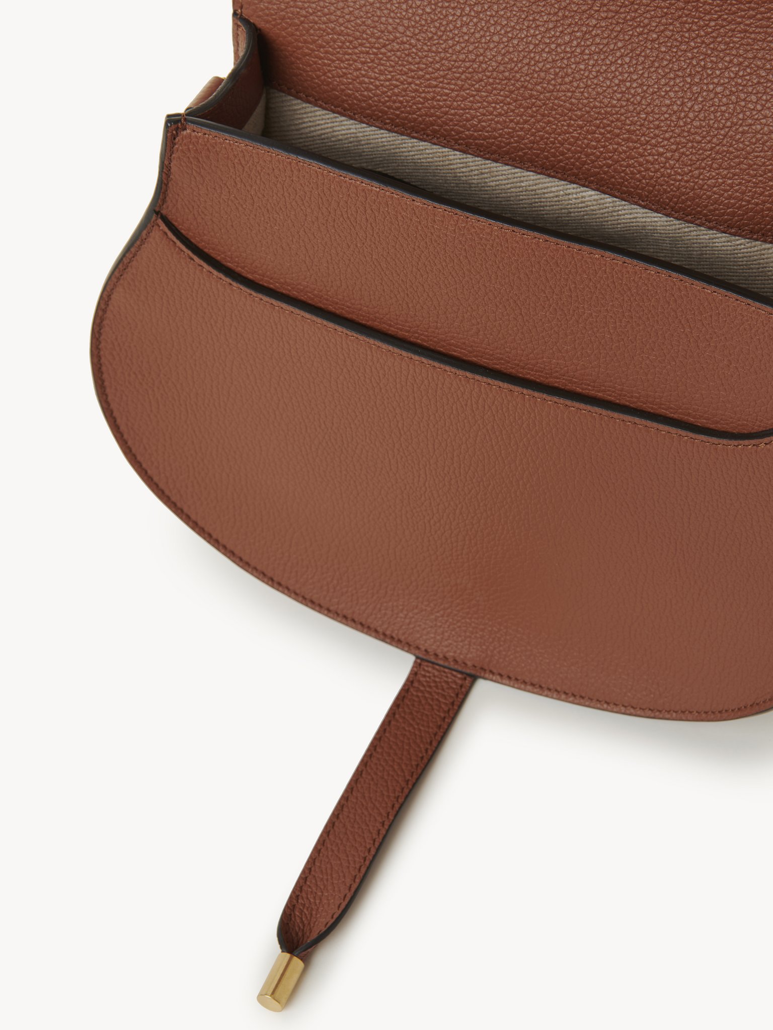 Marcie saddle bag in grained leather Grained calfskin
Tan Front view of the product being worn