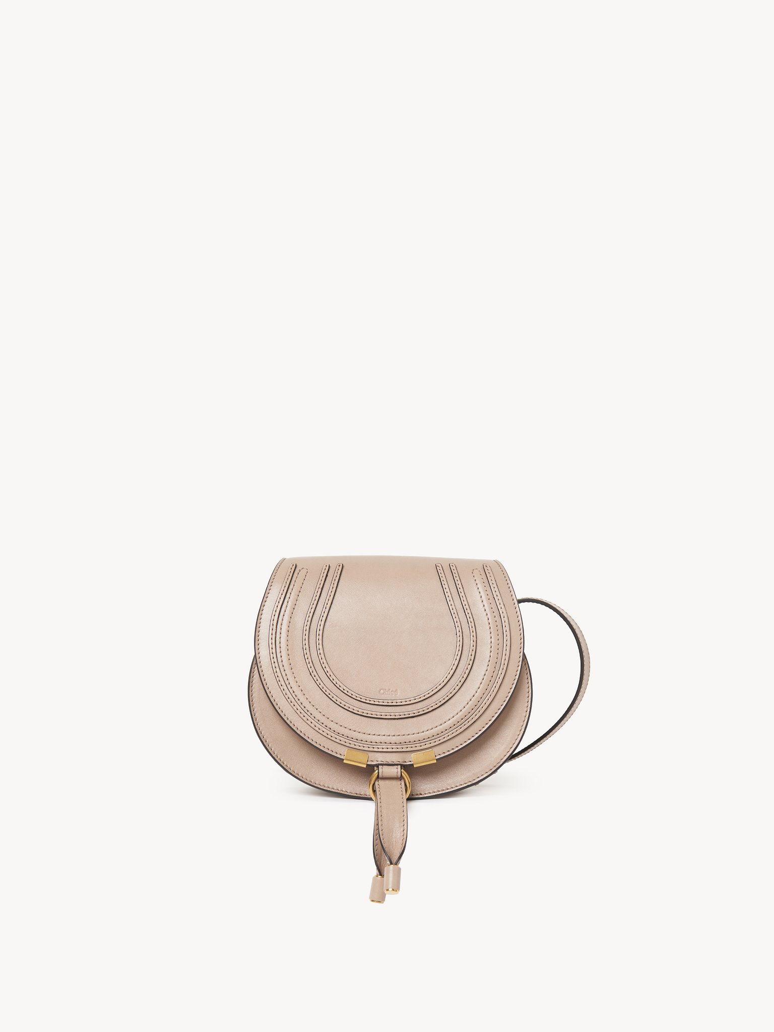 Borsa saddle Marcie piccola in pelle lucida Pelle di vitello lucida
Deep Beige