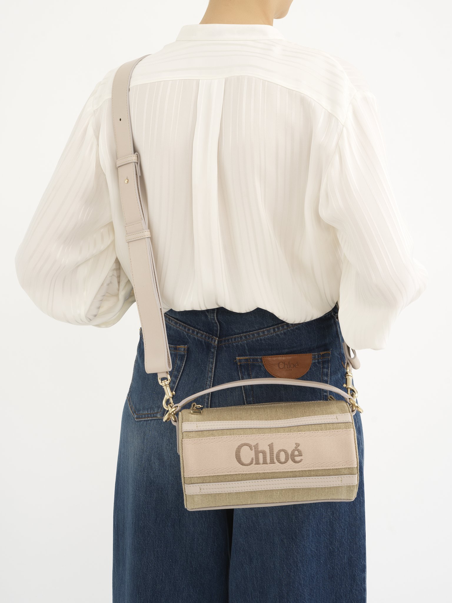 Woody tube shoulder bag in linen & soft leather Chloé logo webbing, linen canvas & calfskin
Wild Grey Back view of the product