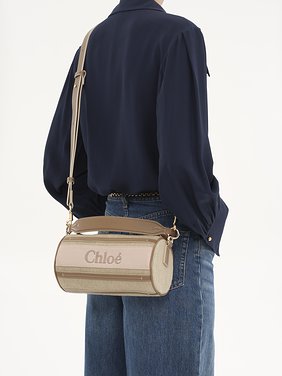 Woody tube shoulder bag in linen & soft leather Chloé logo webbing, linen canvas & calfskin
Blushy Beige Back view of the product