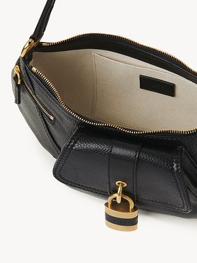 The 99 shoulder bag in grained leather Shiny grained calfskin
Black Front view of the product being worn