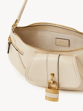 The 99 shoulder bag in grained leather Shiny grained calfskin
Sweet Beige Front view of the product being worn