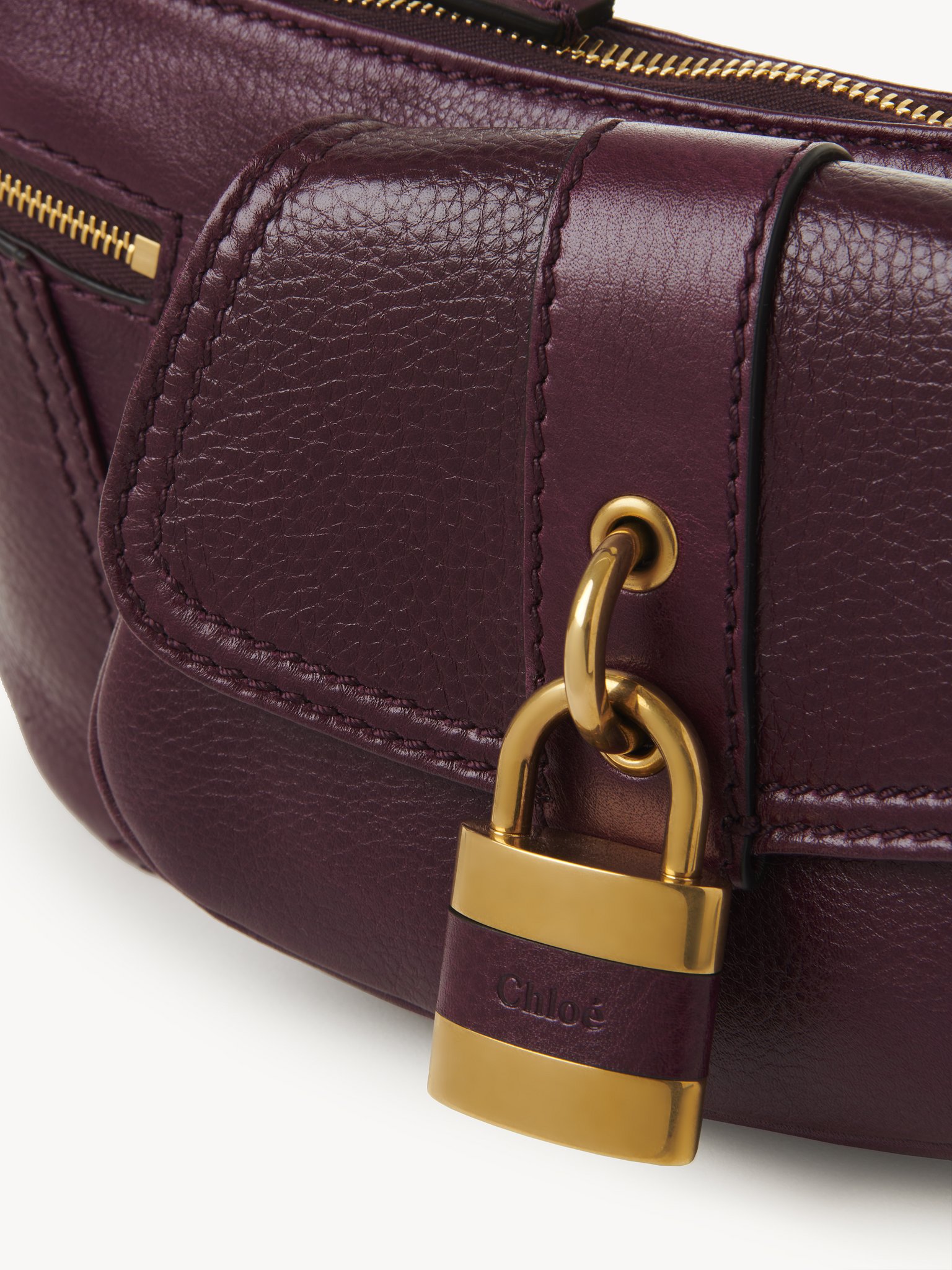 The 99 shoulder bag in grained leather Shiny grained calfskin
Dimness Purple Front view of the product being worn