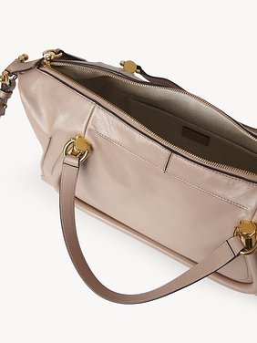 Paraty 24 bag in shiny leather Natural shiny calfskin
Deep Beige Front view of the product being worn