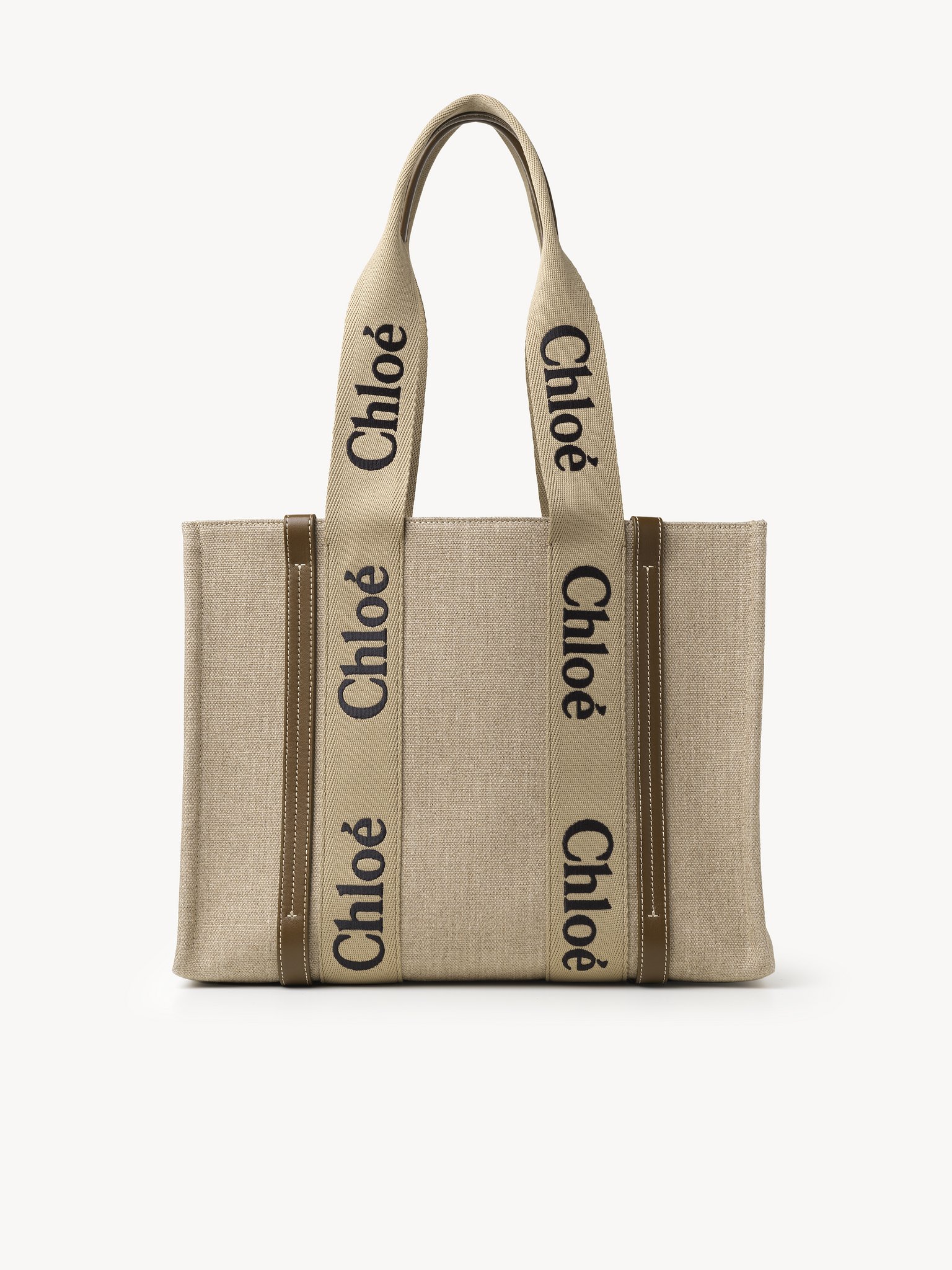 Woody tote bag in linen Linen canvas, calfskin & webbing
Bronze Brown