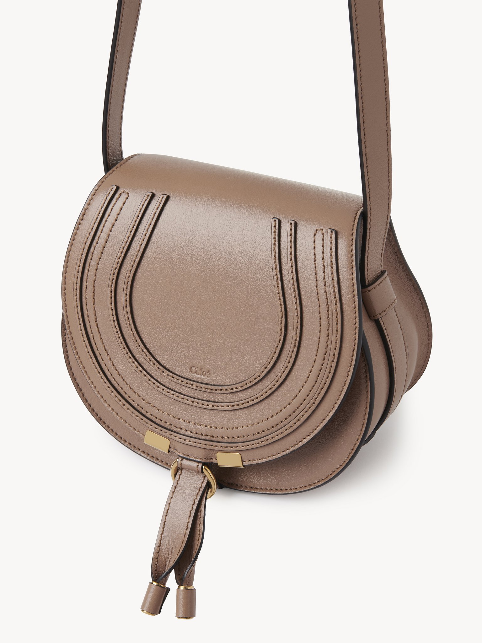 Small Marcie saddle bag in shiny leather Shiny calfskin
Woodrose Product detail