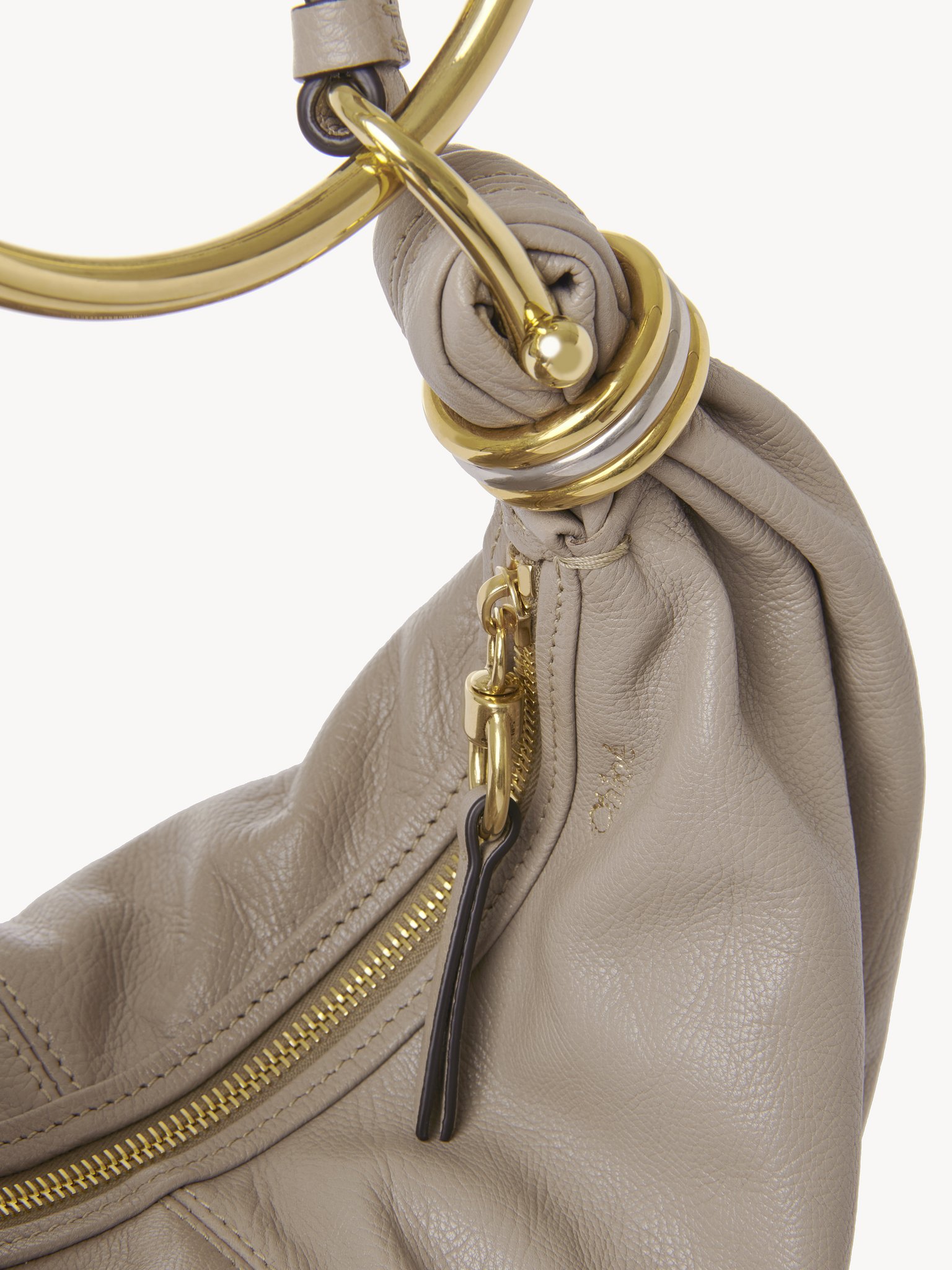 Small Bracelet hobo bag in grained leather Shiny grained calfskin
Motty Grey Front view of the product being worn