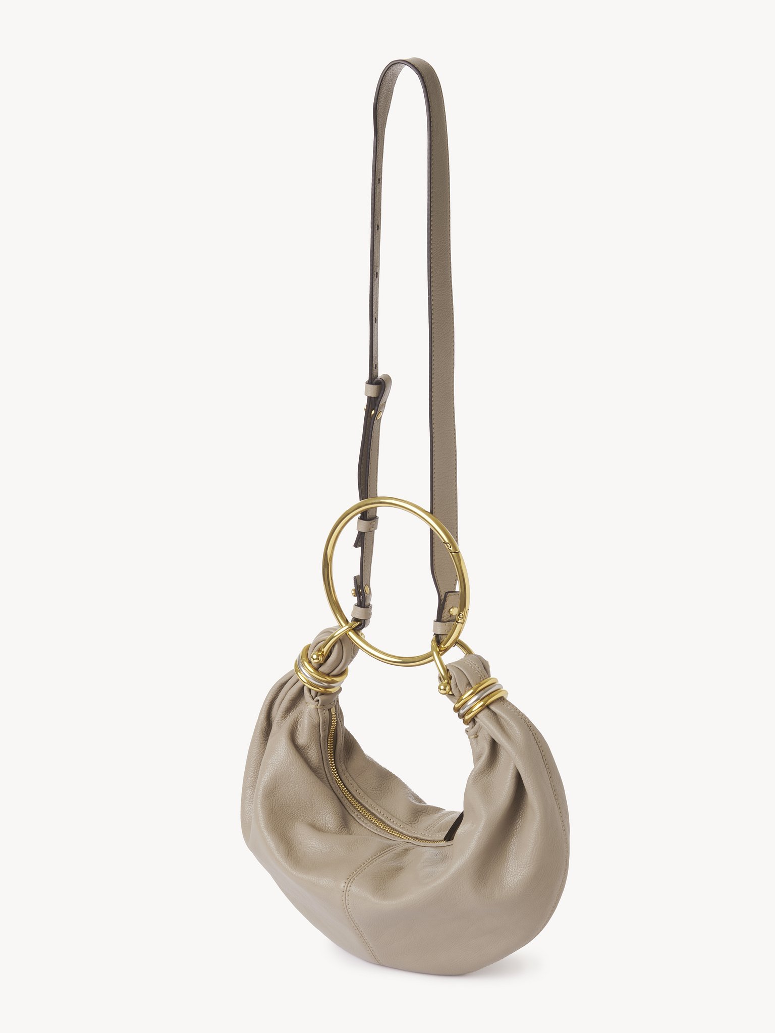 Small Bracelet hobo bag in grained leather Shiny grained calfskin
Motty Grey Product detail