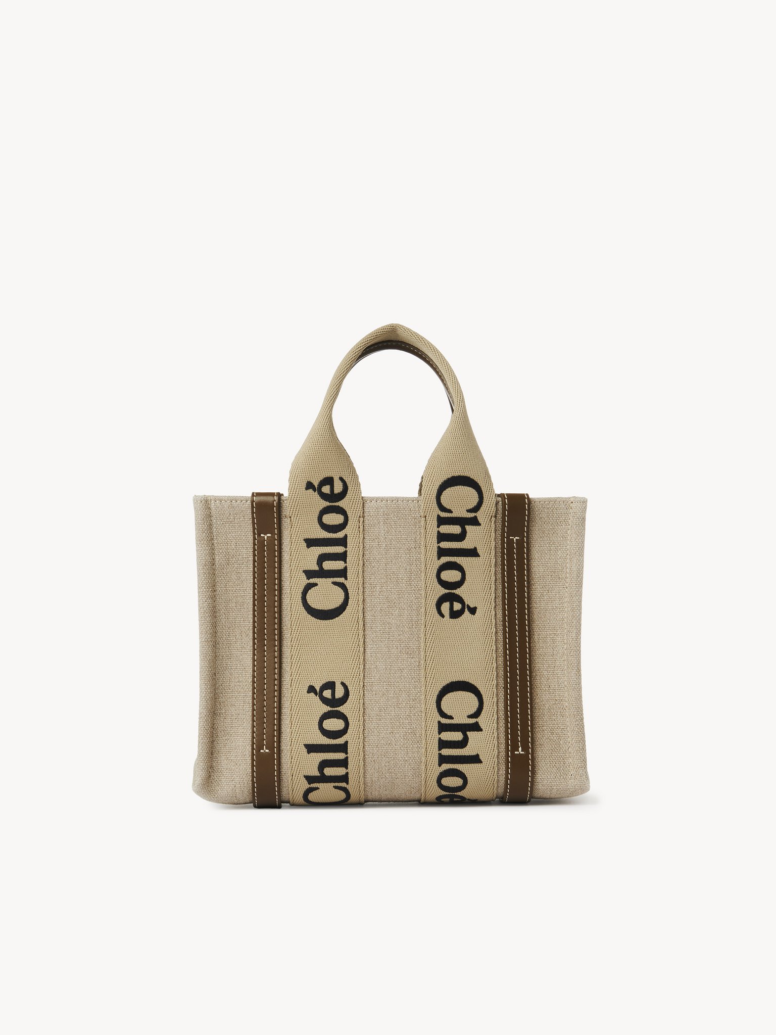 Small Woody tote bag in linen Linen canvas, calfskin & webbing
Bronze Brown Top view of the product