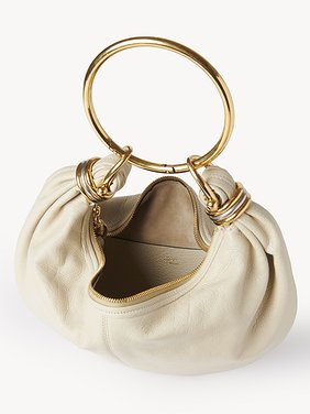 Small Bracelet hobo bag in grained leather Shiny grained calfskin
Vegetal Beige Front view of the product being worn