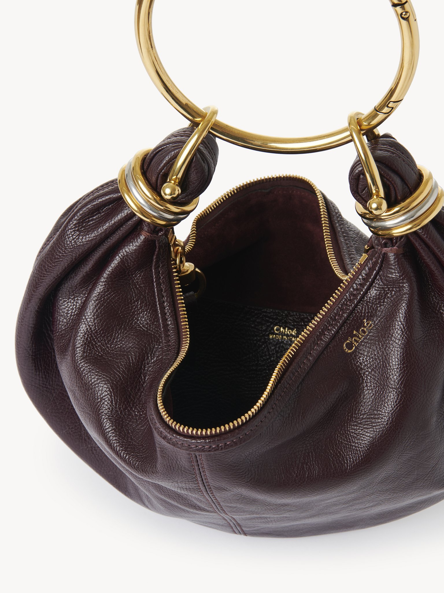 Small Bracelet Hobo bag in grained leather Shiny grained calfskin
Deep Violine Front view of the product being worn