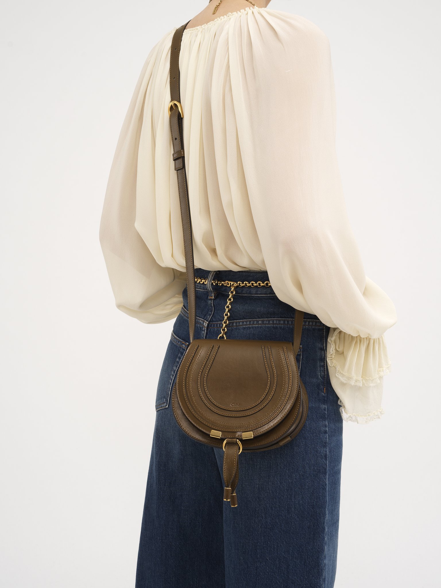 Small Marcie saddle bag in shiny leather Shiny calfskin
Dark Khaki Back view of the product