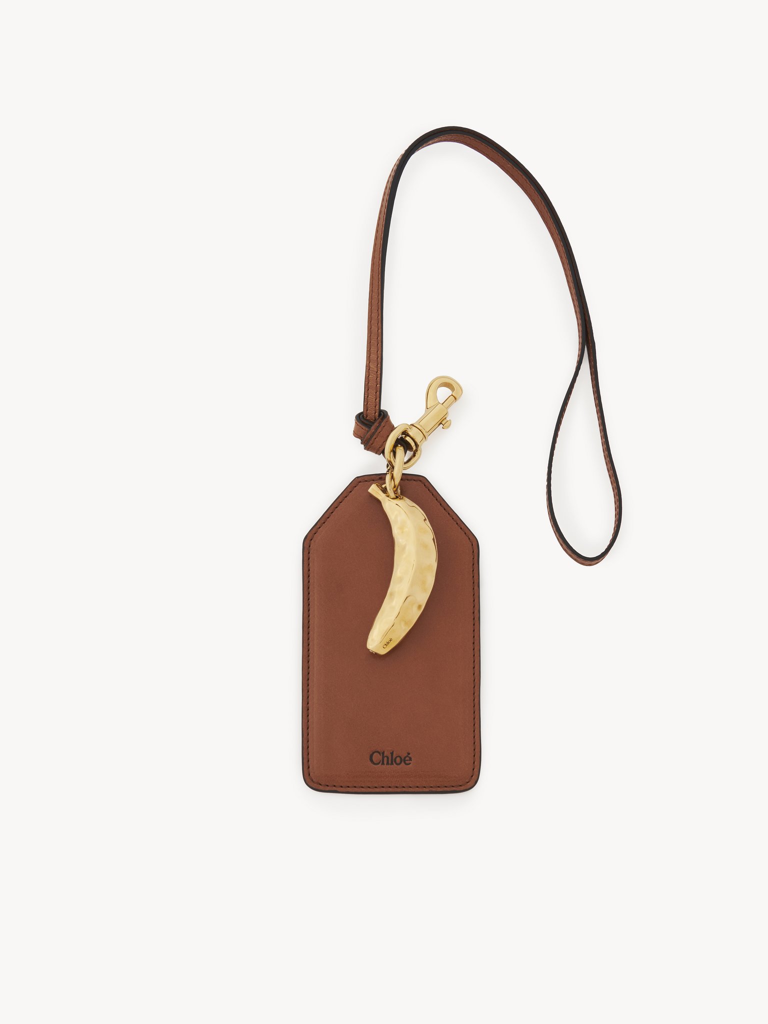 Banana tag in shiny leather Natural shiny buffalo leather
Clay Brown