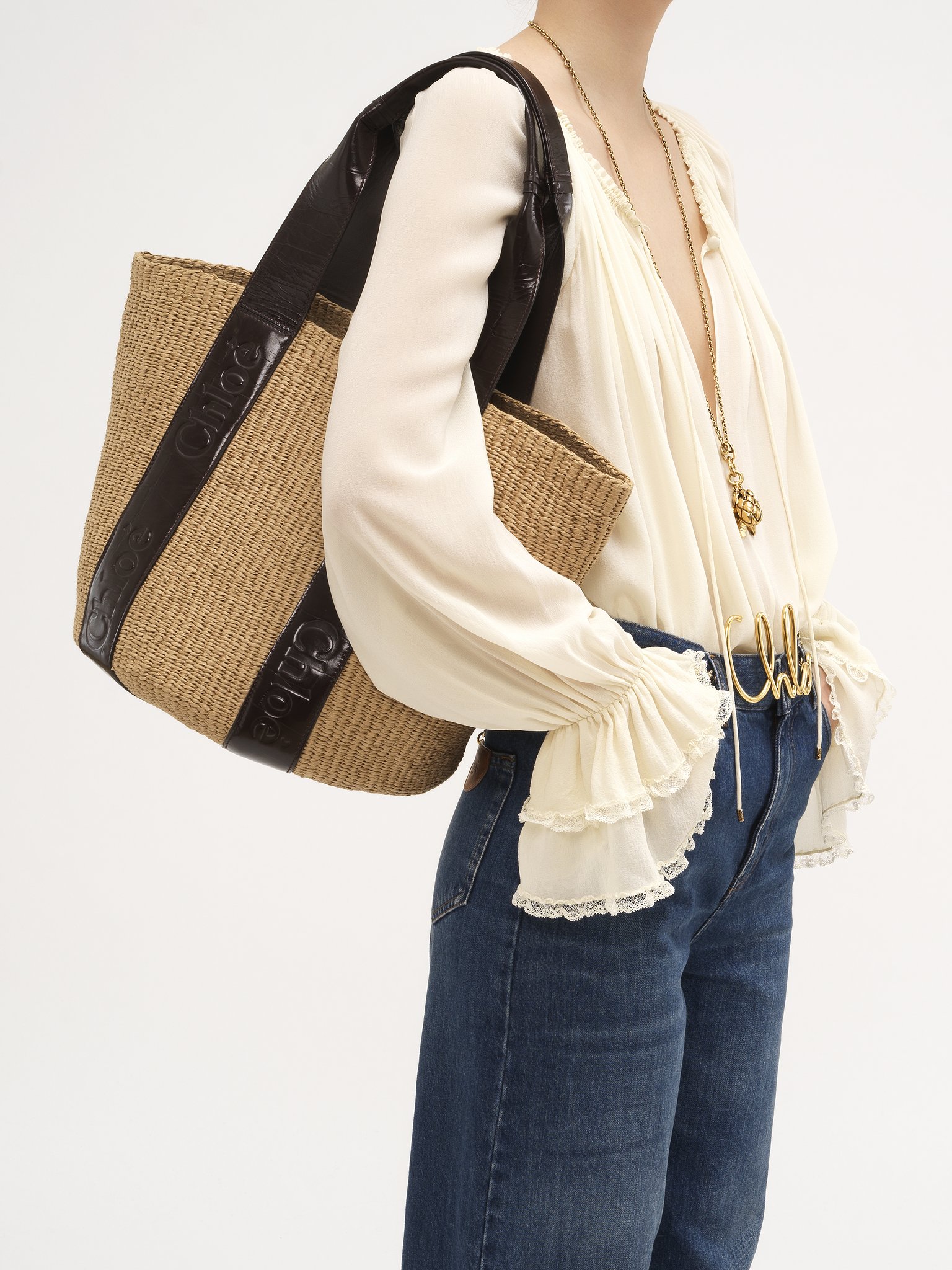 Large Woody tote bag in fair-trade natural fibres Fair-trade paper & croco-effect calfskin
Kohl Brown Back view of the product