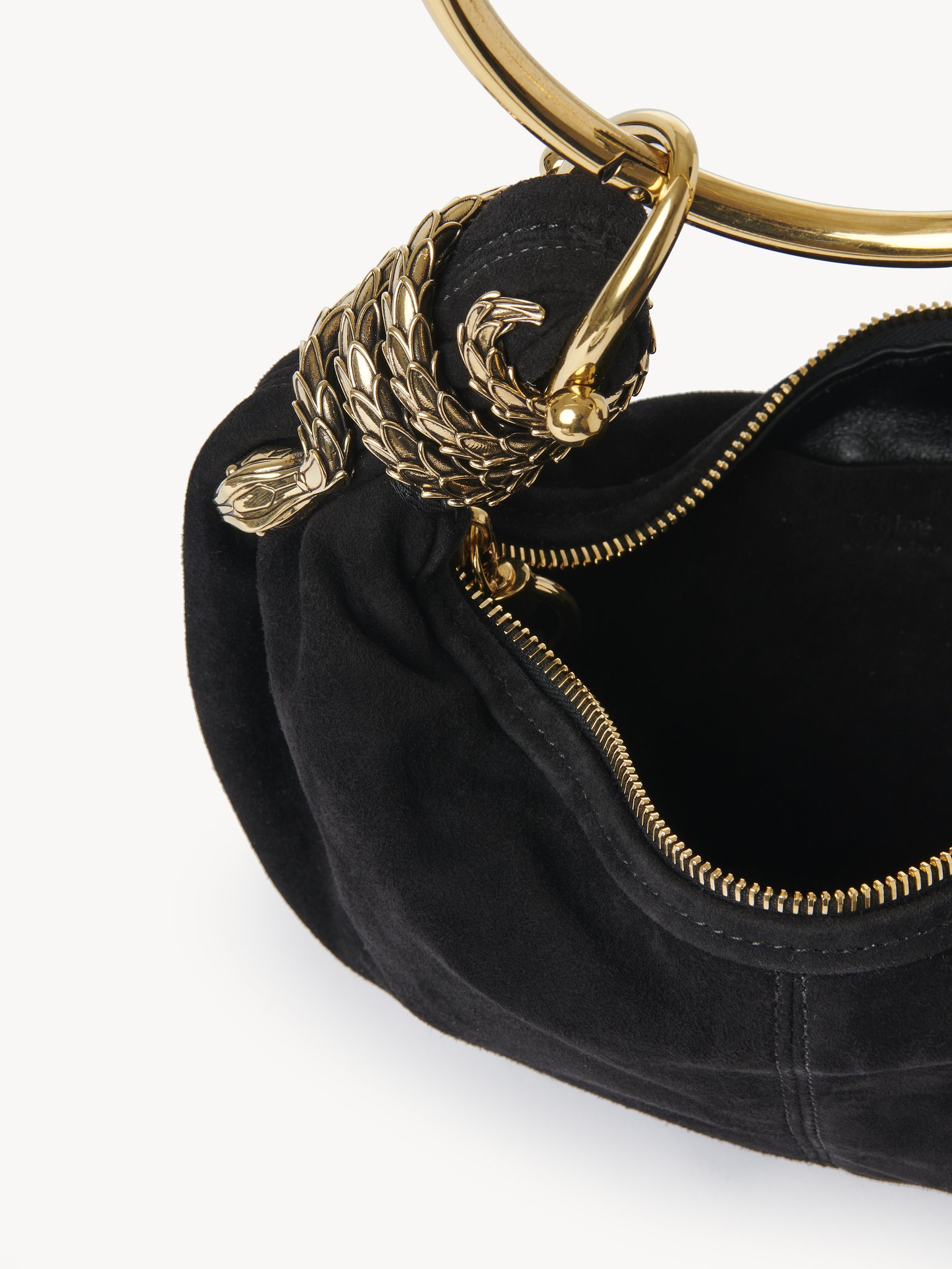 Small Bracelet hobo bag in suede leather Suede goatskin with snake ornament
Black Front view of the product being worn