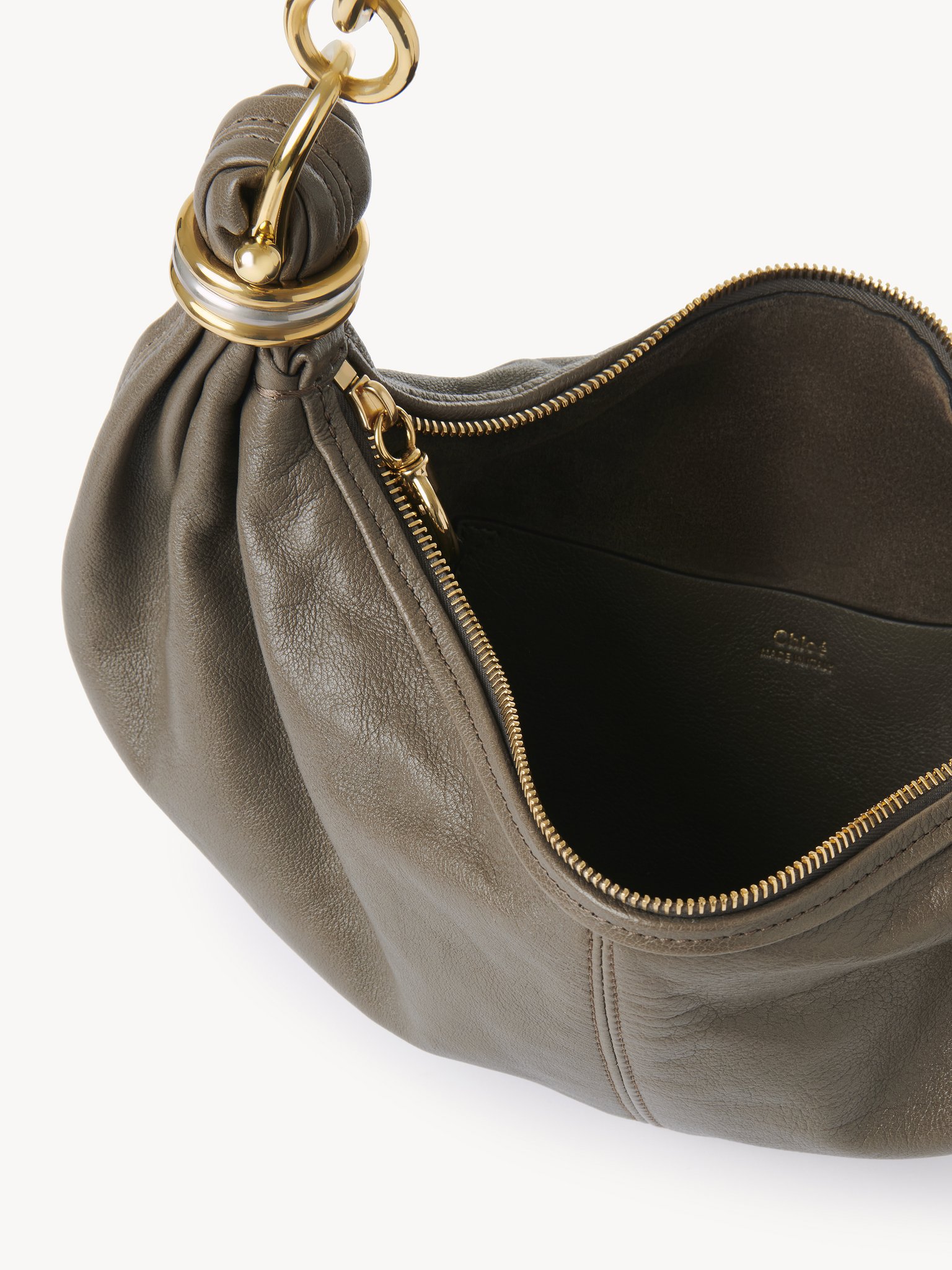 Small Bracelet hobo Bag in grained leather Grained buffalo leather
Flannel Grey Front view of the product being worn