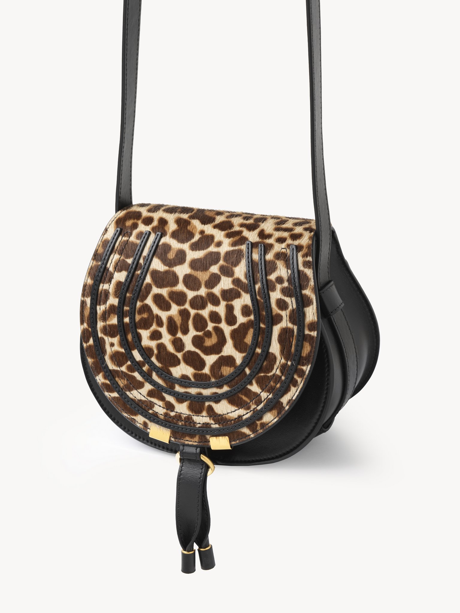 Small Marcie saddle bag in leopard-print leather Leopard-print pony calfskin
Jungle Brown Product detail