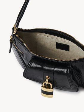 The 99 shoulder bag in croco-effect leather Croco-effect calfskin
Black Front view of the product being worn